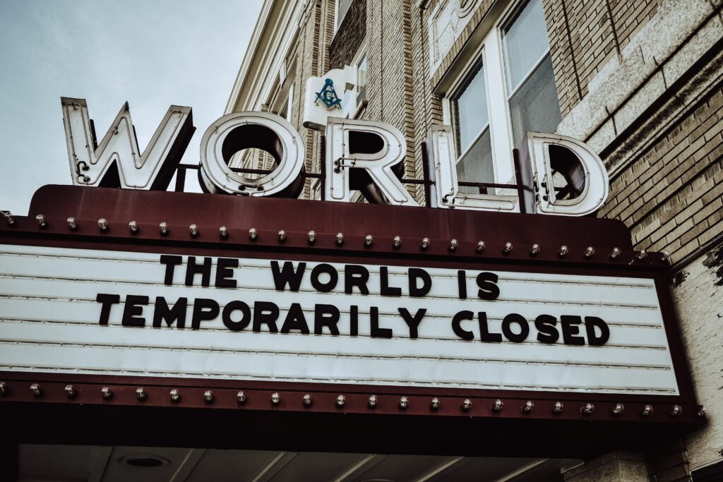 A sign that says "The World is Temporarily Closed"